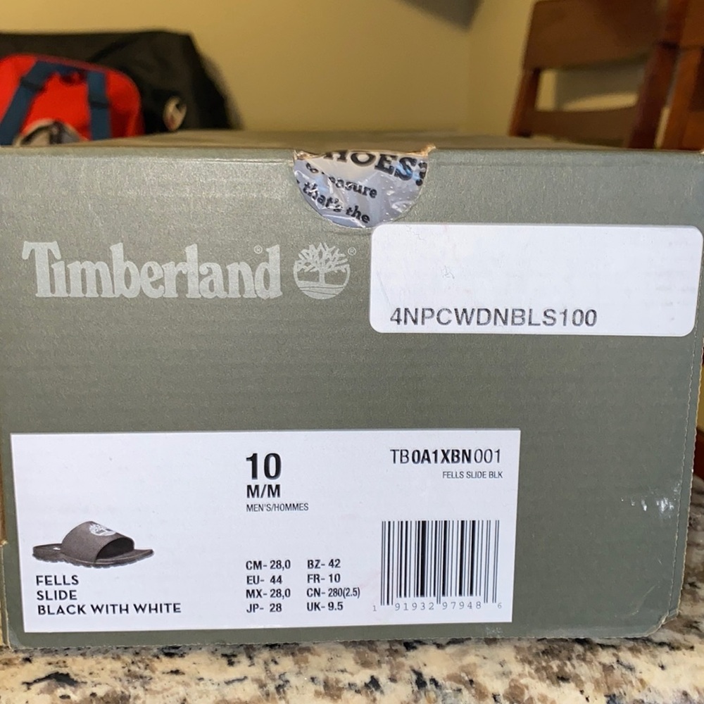 Men’s black and white slides .